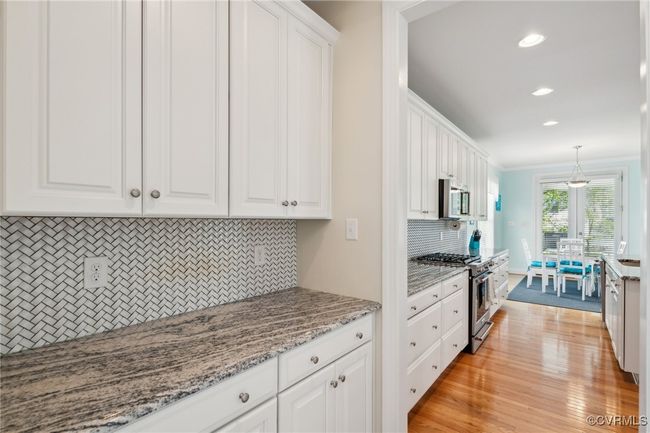 Butler's pantry with matching tile backsplash offers additional prep space and storage. Not pictured is an extra large kitchen pantry with shelving. | Image 9