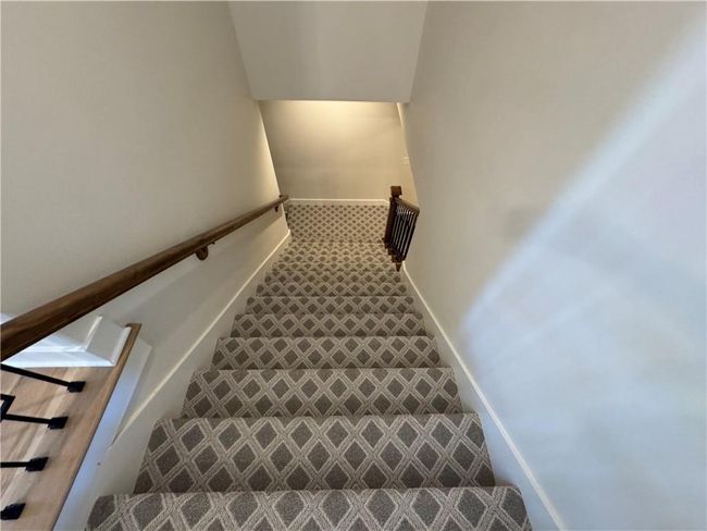 Staircase featuring baseboards and carpet flooring | Image 52