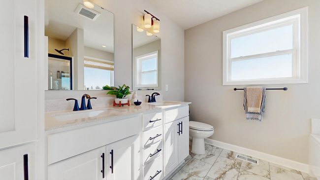 (Photo of a model home, actual features may vary) The owner's bath also features a double vanity! | Image 11