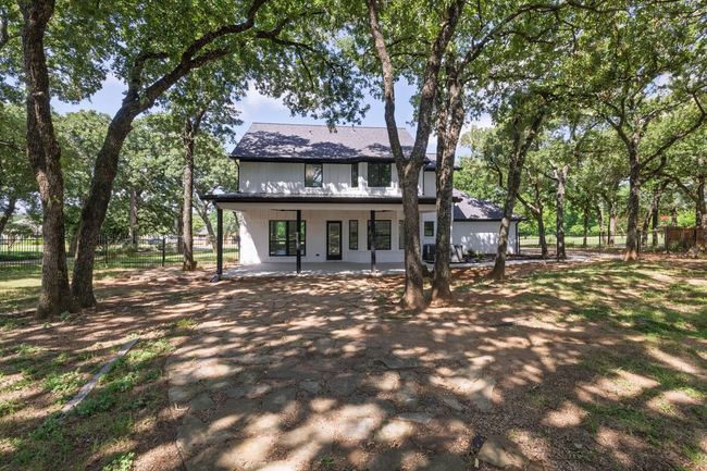 Back of property with a patio area and a shingled roof | Image 40