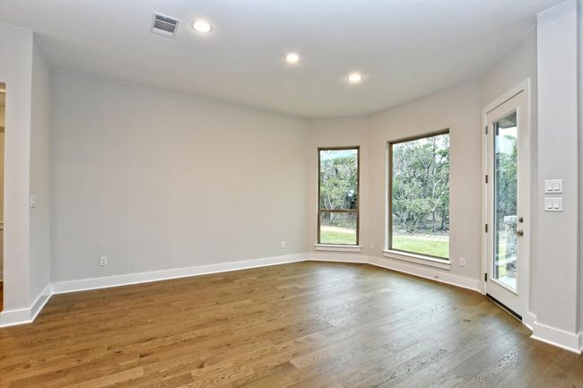 Dining room with baseboards, visible vents, recessed lighting, and wood-type flooring | Image 10