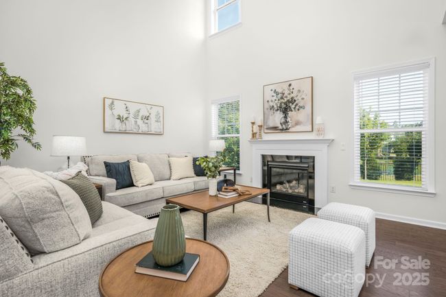 Double ceiling great room with loads of light and a cozy gas fireplace | Image 7