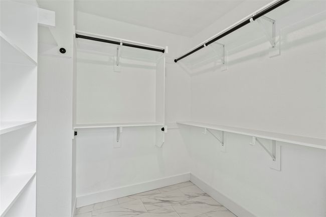 Spacious closet with light marble finish flooring | Image 23