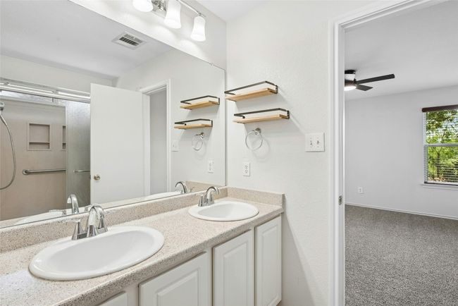 Bathroom with double vanity and a ceiling fan | Image 15