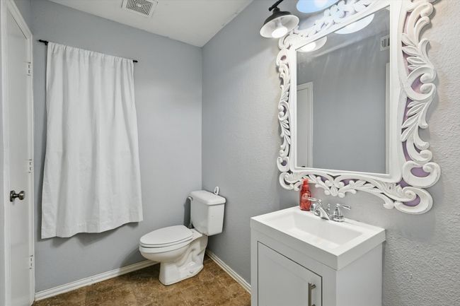 Half bathroom with vanity and toilet | Image 25