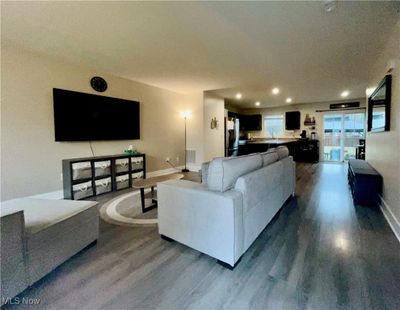 Living room featuring dark wood-type flooring | Image 2