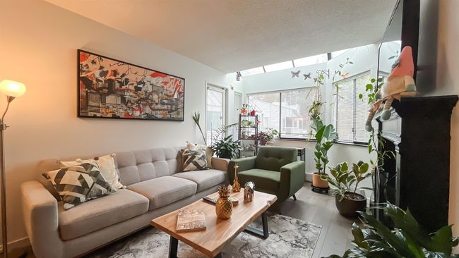 Interior space featuring a skylight and wood finished floors | Image 9