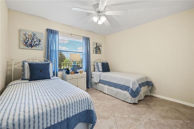 Tiled bedroom with ceiling fan | Image 17