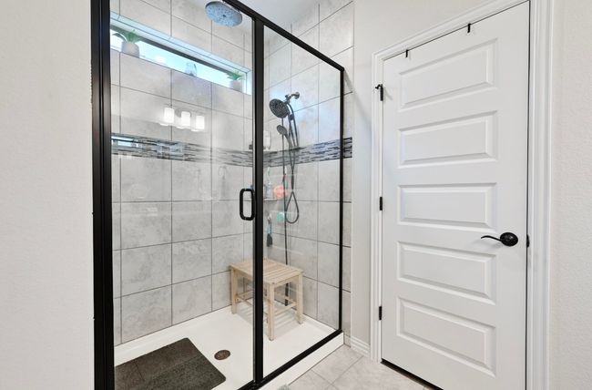 Master Bathroom with a stall shower and tile patterned floors | Image 16