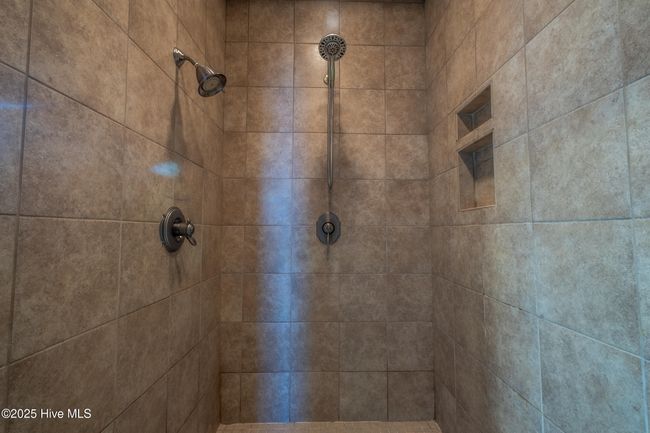 spacious walk-in doorless shower | Image 24