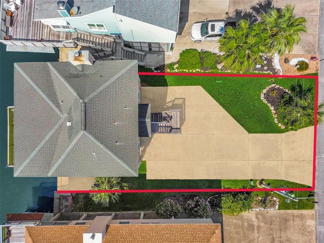 Bird’s-eye view of the full lot shows off the home’s footprint, spacious driveway, and beautifully landscaped yard. | Image 42