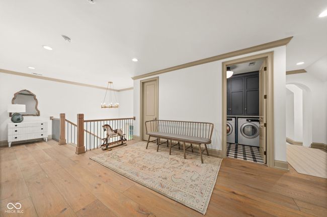 Upper floor south landing featuring a laundry room | Image 51