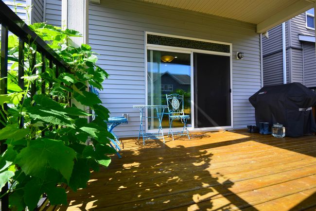 Wooden deck with a grill | Image 36