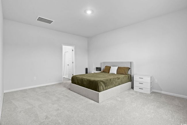 Bedroom with carpet flooring | Image 14