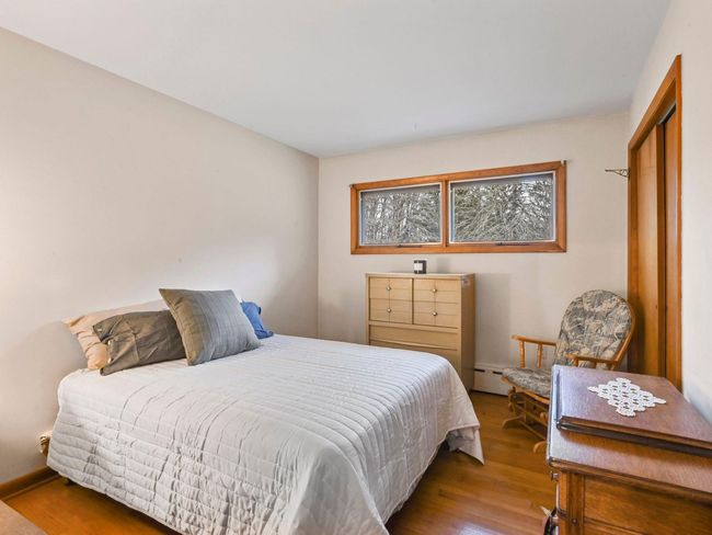 Bedroom featuring light hardwood / wood-style flooring | Image 25