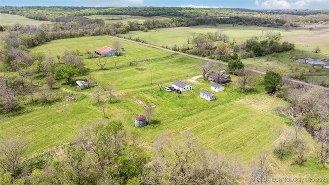 Aerial view of sparsely populated area with a pastoral area | Image 45