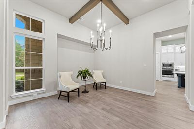 Formal Dining with Engineered Hardwood Flooring, Ceiling Detail, and Direct Access to the Kitchen. | Image 3