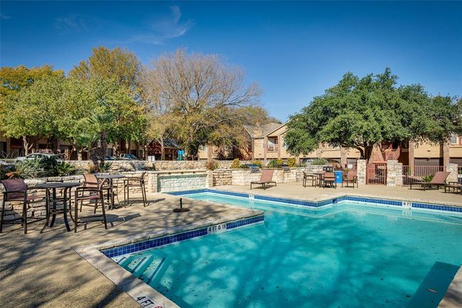 Community pool featuring a patio area | Image 14