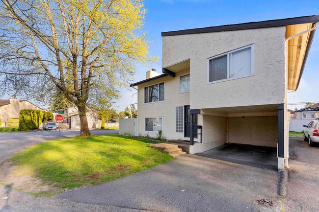 View of front of home with a chimney, stucco siding, and a front lawn | Image 19
