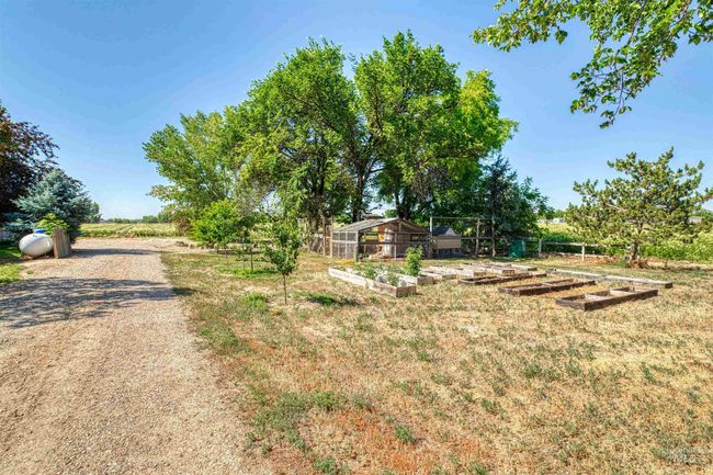 View of grassy yard featuring a garden | Image 36