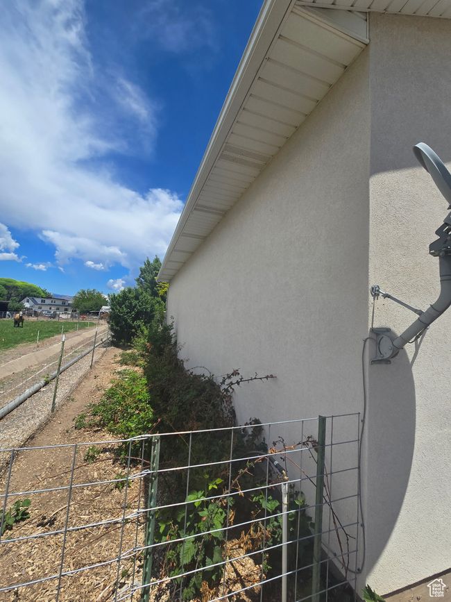 View of side of property featuring stucco siding | Image 59
