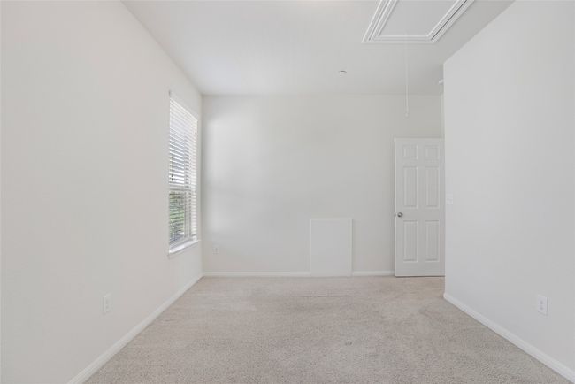 Carpeted spare room with attic access and baseboards | Image 20