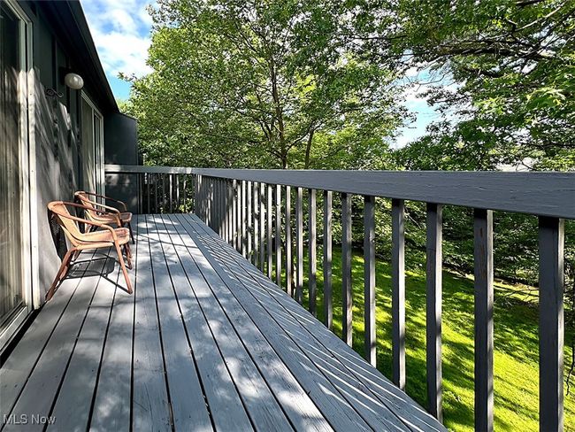 Balcony with view of back wooded property | Image 23