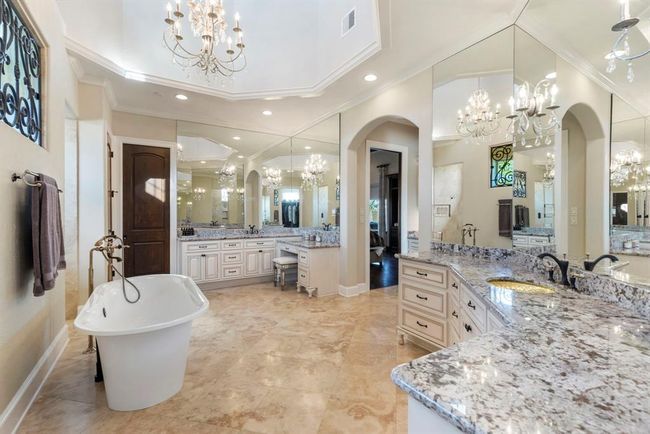 Elegant Master Bath with His-and-Hers Vanities and a Luxurious Freestanding Soaking Tub | Image 19