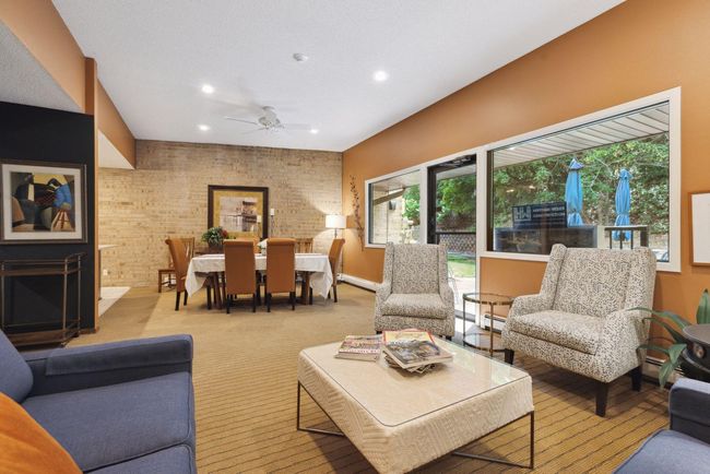 Spacious community party room with ample seating, perfect for gatherings and entertaining friends and family | Image 13