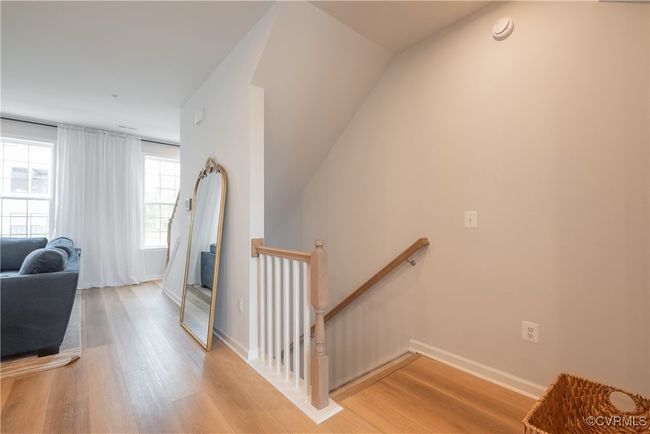 Stairs featuring wood finished floors and baseboards | Image 26