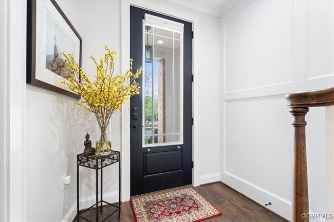 Entryway featuring baseboards and dark wood finished floors | Image 4