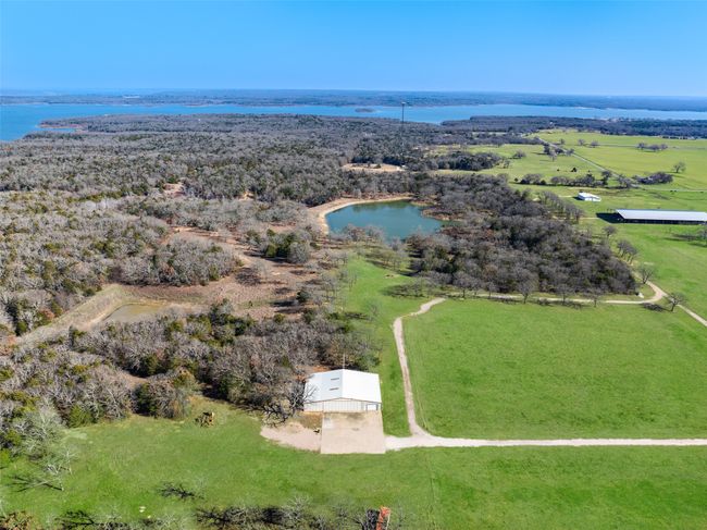 Home build site located between hangar and pond with road access | Image 20