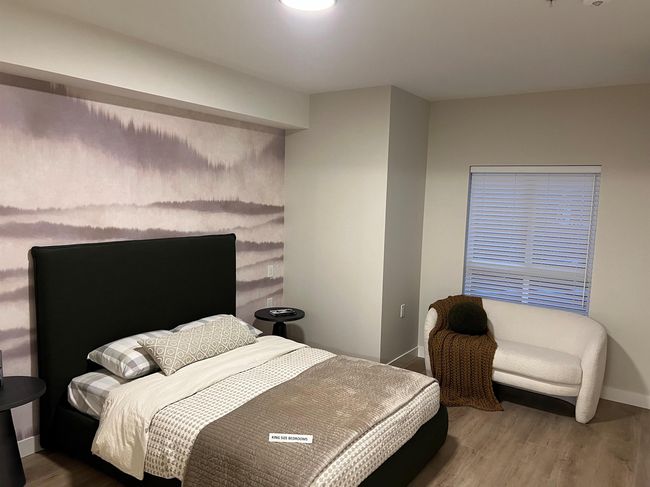 Bedroom with baseboards and wood finished floors | Image 5