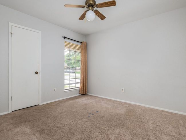Spare room with carpet floors and a ceiling fan | Image 4