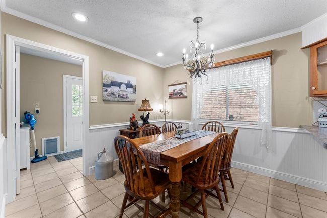 Breakfast area and in home laundry room. | Image 12