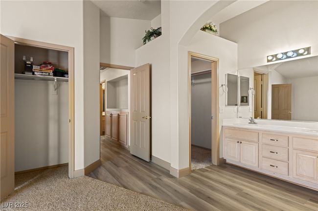 Full bath featuring double vanity and wood finished floors | Image 32