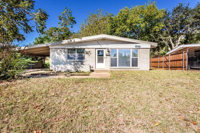 View of front of home featuring a front yard and a carport | Image 2