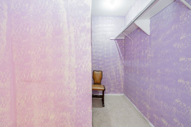 Walk in closet with carpet floors | Image 14