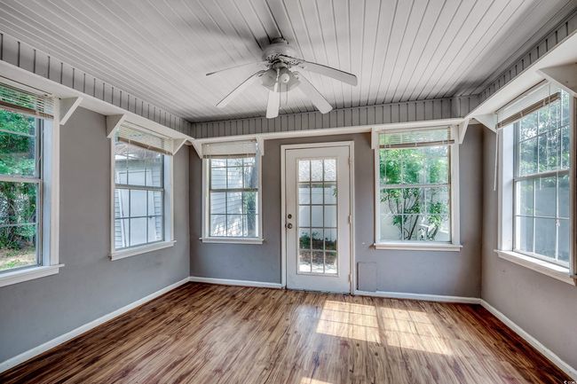 Unfurnished sunroom featuring healthy amount of natural light | Image 32