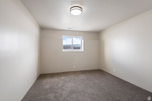 Bedroom featuring carpet and visible vents | Image 18