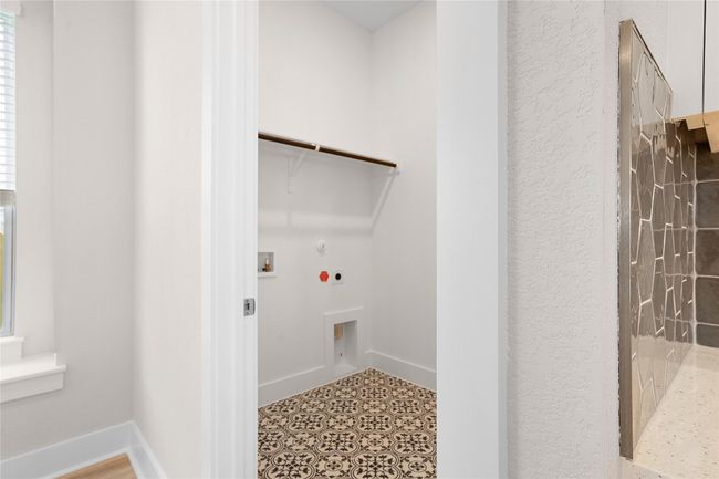 Laundry area featuring electric dryer hookup, hookup for a gas dryer, and washer hookup | Image 9