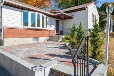 Front patio and covered entry provide a warm greeting. | Image 3