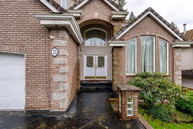Doorway to property with a garage and french doors | Image 4