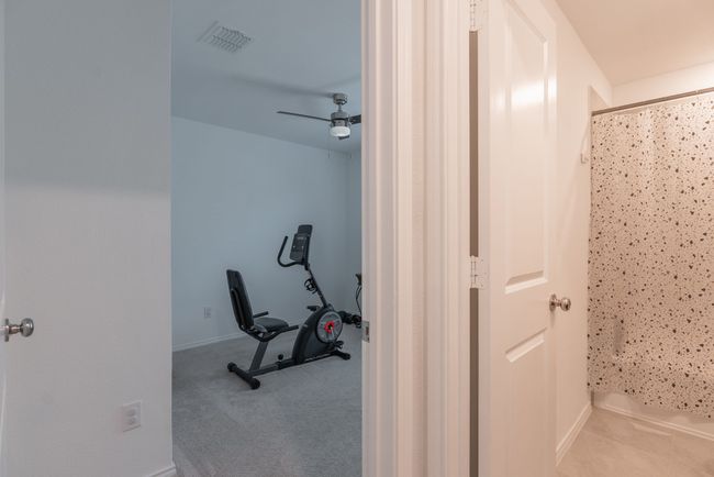 Workout room with visible vents, baseboards, and a ceiling fan | Image 14