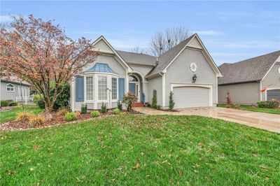 View of front of house with a front yard and a garage | Image 3