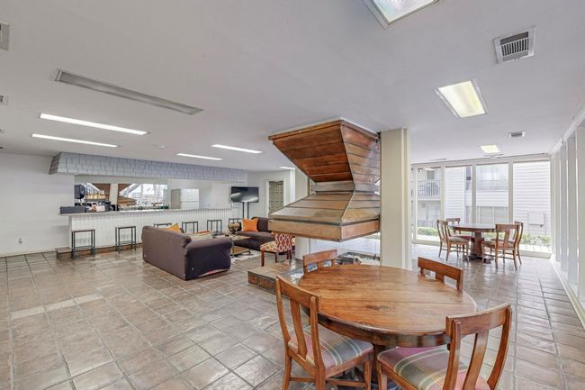 Dining room with visible vents and stone finish flooring | Image 24