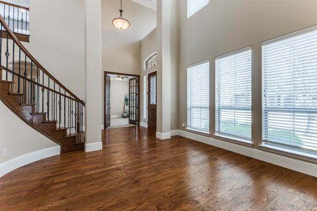 Find elegant nail down hardwood floors, 7 inch baseboards, extensive crown molding and neutral paint colors. | Image 4