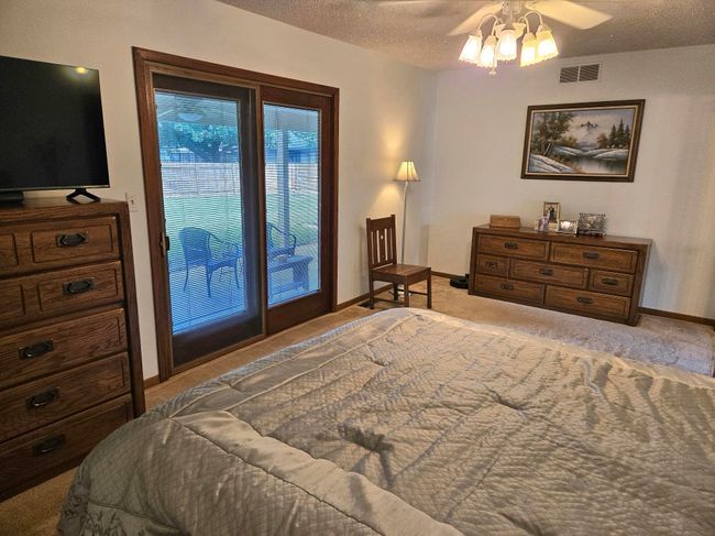 The master bedroom has it's own access to the covered patio and back yard! | Image 12