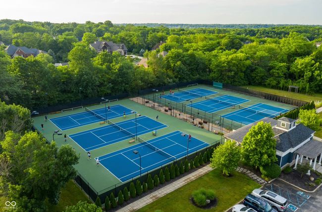 drone / aerial view, Six Outdoor Hard Tennis Courts, three of which are illuminated, Pickleball lines have been added to several courts | Image 125