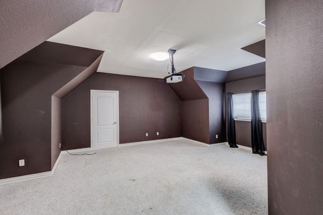 Additional living space with light colored carpet and lofted ceiling | Image 30